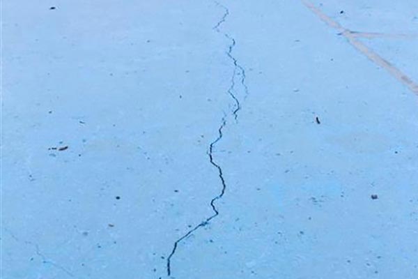 The image shows crack on concrete.