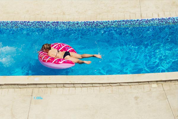 This image shows a woman swimming in a pool.